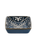 Blue ceramic square dish with white floral pattern interior