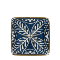 Blue ceramic square dish with white floral pattern interior