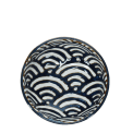 Round ceramic bowl with white wave pattern interior
