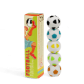 Stack of football-shaped highlighters next to colourful product box.