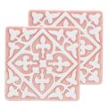 Set of two pink ceramic coaster with embossed pattern.