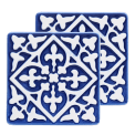 Set of two blue ceramic coaster with embossed pattern.