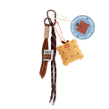 Plush toast bag charm with brown cord strap and metal clip attachment with tag.
