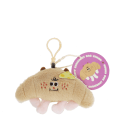 Fluffy croissant bag charm with smiley face, cheese patch and clip attachment with tag.