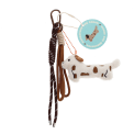 Plush sausage dog bag charm with brown spots, cord strap and metal clip with tag.