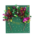 Festive Christmas party headband with colourful tinsel and star decorations.