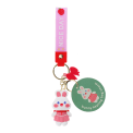 Bunny bag charm with pink outfit, silicone wrist strap and bow detail with tag.