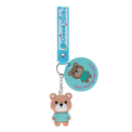 Bear bag charm with blue outfit, silicone wrist strap and silver keyring with tag.