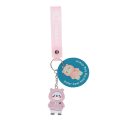 Polar bear bag charm with pink hoodie, silicone wrist strap and silver keyring with tag.
