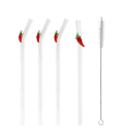 Four reusable glass drinking straws with red chilli toppers and cleaning brush