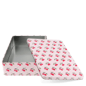 Rectangular pink storage tin with removable lid in red cherry pattern