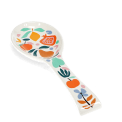 White ceramic spoon rest with a colourful fruit and leaf design.