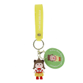 Strawberry girl bag charm with yellow polka dot skirt, silicone wrist strap and keyring with tag.