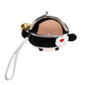 Crochet girl-shaped coin purse with a metal clasp and hanging bell charm with tag.