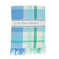 Blue, green and white check blanket folded.