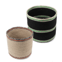 Set of two round jute storage baskets in natural and black.