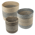 Set of three round jute striped jute baskets in assorted sizes.