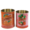 Set of two retro-style storage tins with marmalade and wild strawberry preserve designs
