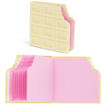 White chocolate bar-shaped notebook shown closed with bite-mark pages and open to reveal pink sheets.