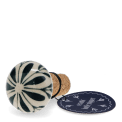 Ceramic and cork bottle stopper with leaf design with tag.