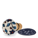 Ceramic and cork bottle stopper with floral and leaf pattern with tag.