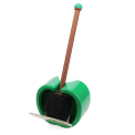 Green apple-shaped wall-mounted toilet brush with holder and black bristle head