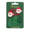 Set of four Christmas hair clips featuring Santa faces and glitter Christmas trees