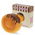 Chocolate-topped cromboloni squishy toy shown beside matching display box.