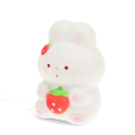 White bunny squishy toy holding a strawberry, with pink paw design