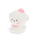 White bear squishy toy with pink bow tie and hat, featuring a soft rounded design.