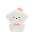 White bear squishy toy with pink bow tie and hat, featuring a soft rounded design.