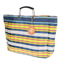 Large woven shopping bag with blue, yellow and white striped design and black handles.