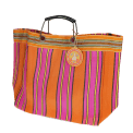 Large woven shopping bag with orange and pink striped design and black handles.