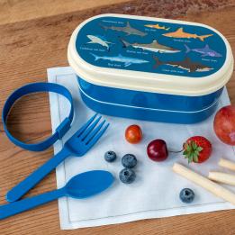 Dark blue plastic bento box with cream lid and middle tray featuring pictures of sharks