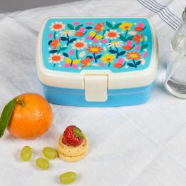 Light blue plastic lunch box with cream and light blue lid featuring print of butterflies amongst flowers