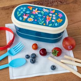 Dark blue plastic bento box with cream lid and middle tray featuring print of fairies amongst flowers