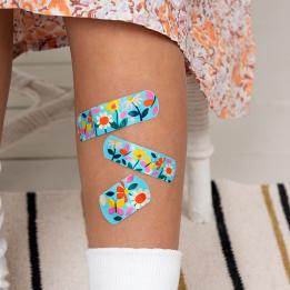 Light blue plasters with print of butterflies and flowers