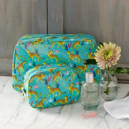 Turquoise oilcloth wash bag and makeup bag collection with print of cheetahs