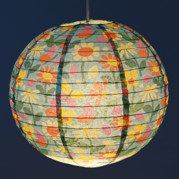 Paper lampshade with illustrations of butterflies among flowers hung with light on shining through