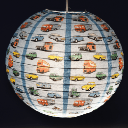 Paper lampshade with vintage style illustrations of classic cars vehicles hung with light on shining through