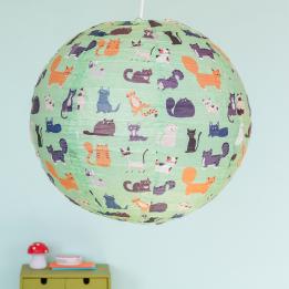 Light green paper lampshade with cat decoration installed in room