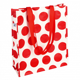 Recycled plastic shopping bag in cream with red spots