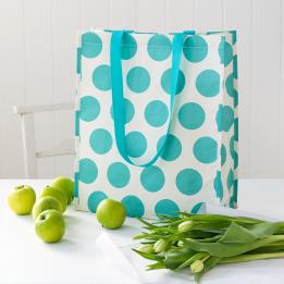 Recycled plastic shopping bag turquoise circles cream background
