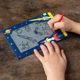 Child drawing on Space Age Magic Slate