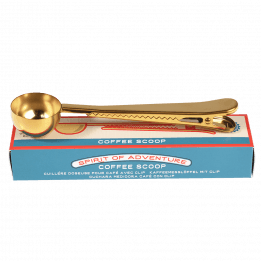 Spirit of Adventure coffee scoop with bag clip on top of box