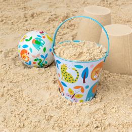 Wild Wonders tin bucket containing sand alongside play ball and sandcastles