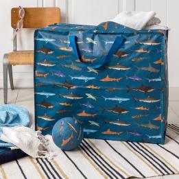 Sharks jumbo bag containing a throw alongside play ball and additional throws/rugs