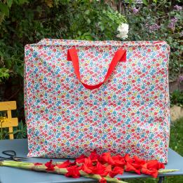 Tilde jumbo storage bag on garden table with flowers
