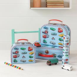 Road Trip storage cases with toy vehicles, kaleidscope and rainbow pencil on table