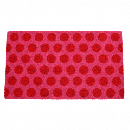 Coir doormat with red spots on pink surface